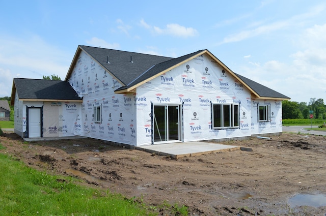 1303 Iris Ln, Saint Joseph, MN 56374 - rear view of property featuring a shingled roof