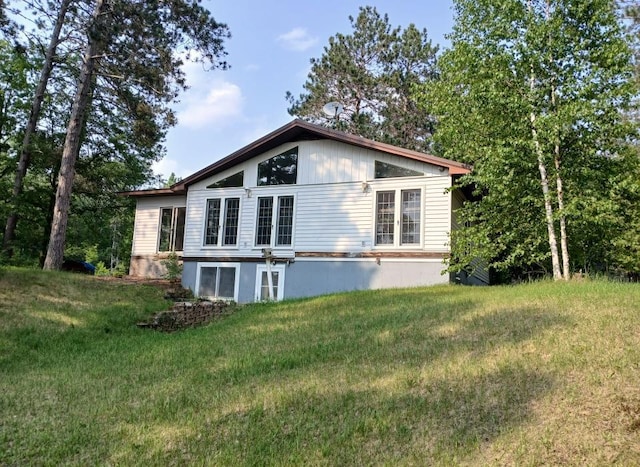 37059 Pinewood Dr, Lawrence Twp, MN 55709 - view of property exterior with a yard