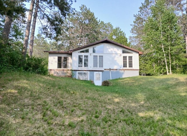 37059 Pinewood Dr, Lawrence Twp, MN 55709 - rear view of house featuring a lawn