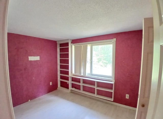 37059 Pinewood Dr, Lawrence Twp, MN 55709 - carpeted spare room featuring a textured ceiling