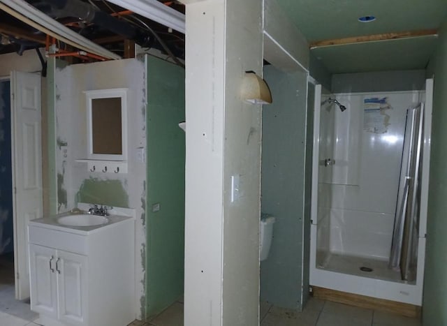 37059 Pinewood Dr, Lawrence Twp, MN 55709 - full bathroom featuring vanity, a stall shower, and tile patterned floors