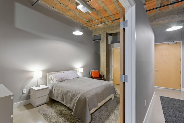 718 Washington Ave N Unit 612, Minneapolis, MN 55401 - bedroom featuring baseboards and brick ceiling
