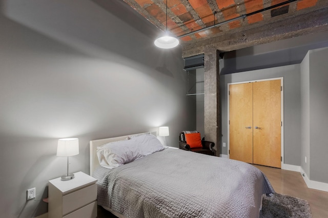718 Washington Ave N Unit 612, Minneapolis, MN 55401 - bedroom featuring baseboards and finished concrete floors