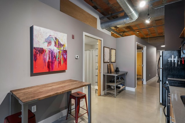 718 Washington Ave N Unit 612, Minneapolis, MN 55401 - dining room with finished concrete floors and baseboards