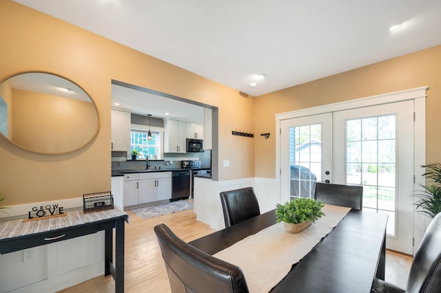 114 Chester Pkwy, Duluth, MN 55805 - dining space featuring french doors and light wood-type flooring