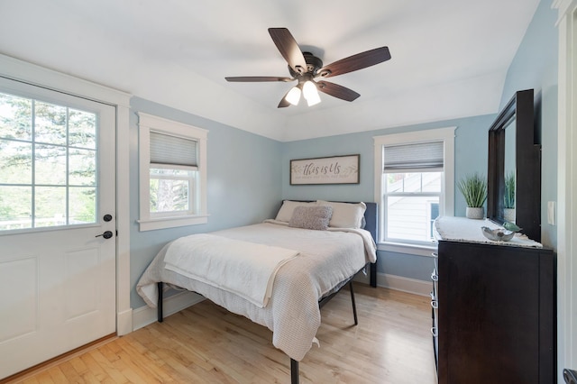 114 Chester Pkwy, Duluth, MN 55805 - bedroom with multiple windows, light wood finished floors, and a ceiling fan