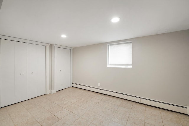 114 Chester Pkwy, Duluth, MN 55805 - unfurnished bedroom featuring a baseboard heating unit and recessed lighting