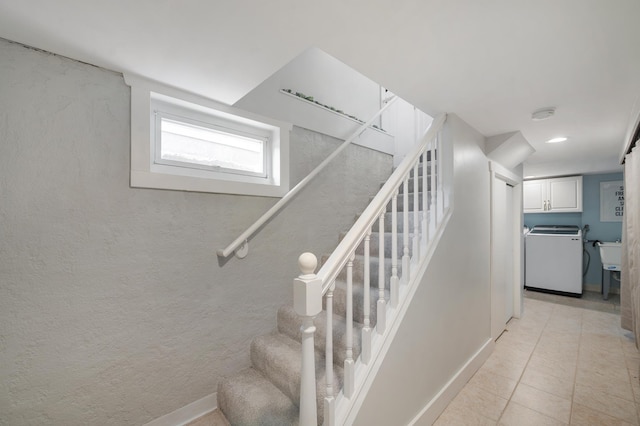 114 Chester Pkwy, Duluth, MN 55805 - stairs featuring washer / clothes dryer and tile patterned floors