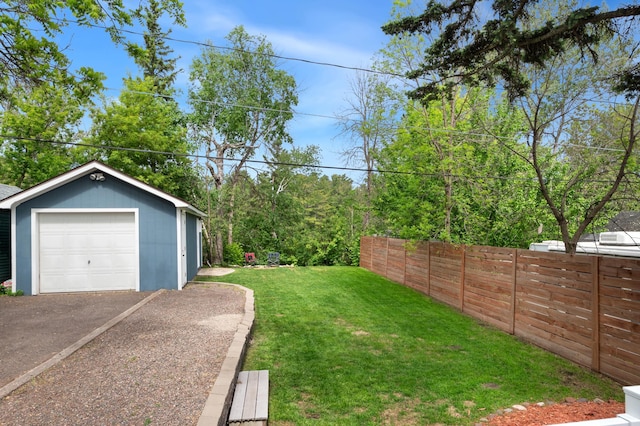 114 Chester Pkwy, Duluth, MN 55805 - view of yard with a garage, an outdoor structure, and asphalt driveway