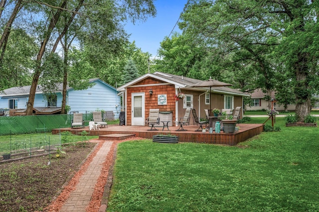 1015 Lake St N, Big Lake, MN 55309 - back of property with a wooden deck and a garden