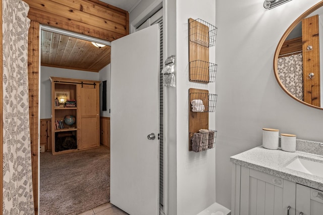1015 Lake St N, Big Lake, MN 55309 - bathroom featuring vanity, a wainscoted wall, and wood ceiling