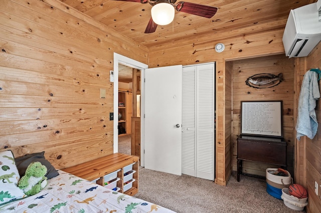 1015 Lake St N, Big Lake, MN 55309 - bedroom featuring an AC wall unit, carpet flooring, wood walls, a closet, and wooden ceiling