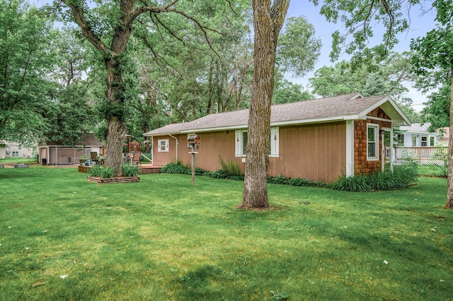 1015 Lake St N, Big Lake, MN 55309 - view of green lawn with a wooden deck
