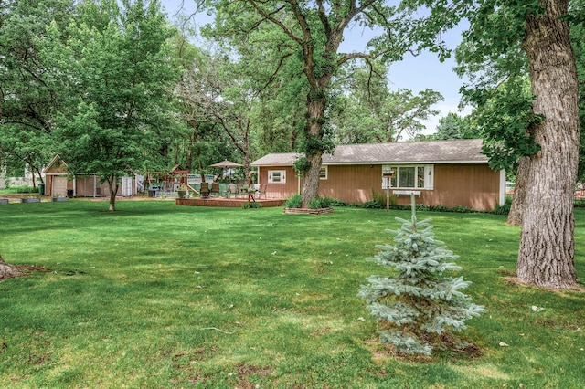 1015 Lake St N, Big Lake, MN 55309 - view of grassy yard with a deck