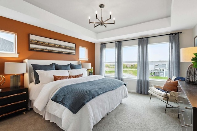 2963 Trinity Dr, Shakopee, MN 55379 - carpeted bedroom with a raised ceiling and a chandelier