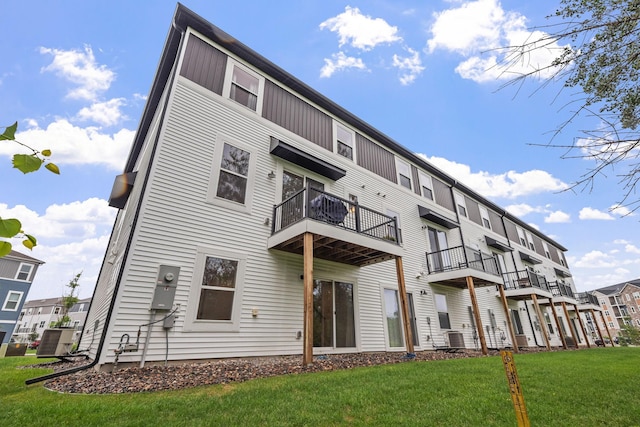 8612 Kenyon Ct NE Unit A, Blaine, MN 55449 - rear view of house with a yard and a balcony