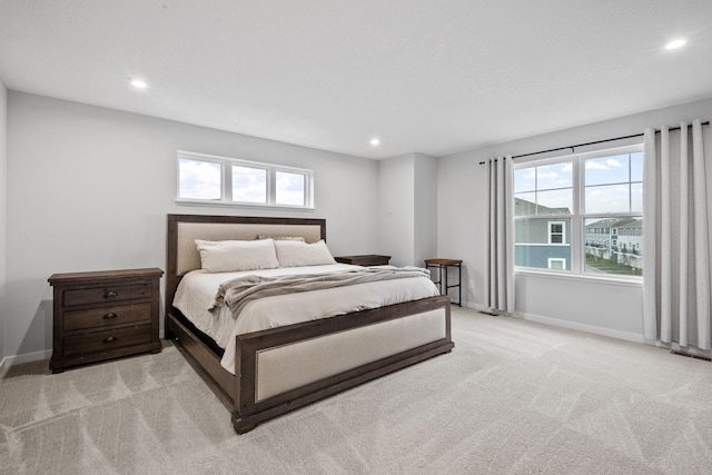 8612 Kenyon Ct NE Unit A, Blaine, MN 55449 - bedroom with light carpet, recessed lighting, and multiple windows