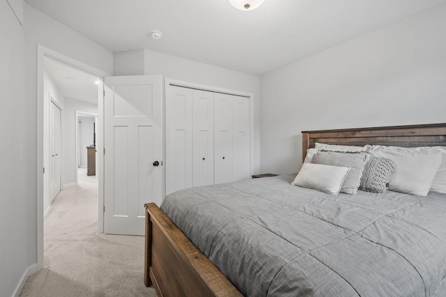 8612 Kenyon Ct NE Unit A, Blaine, MN 55449 - bedroom featuring light carpet and a closet
