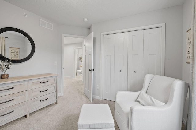 8612 Kenyon Ct NE Unit A, Blaine, MN 55449 - sitting room featuring light colored carpet and baseboards