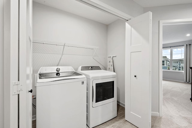 8612 Kenyon Ct NE Unit A, Blaine, MN 55449 - washroom featuring separate washer and dryer and light carpet