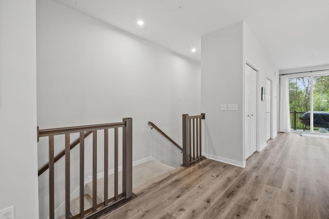 8612 Kenyon Ct NE Unit A, Blaine, MN 55449 - hall featuring an upstairs landing, wood finished floors, and recessed lighting
