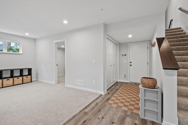 8612 Kenyon Ct NE Unit A, Blaine, MN 55449 - foyer entrance with stairway, wood finished floors, and recessed lighting