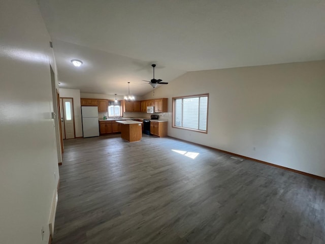 809 Aspen Cir, Waite Park, MN 56387 - kitchen featuring white appliances, open floor plan, vaulted ceiling, light countertops, and dark wood-style flooring