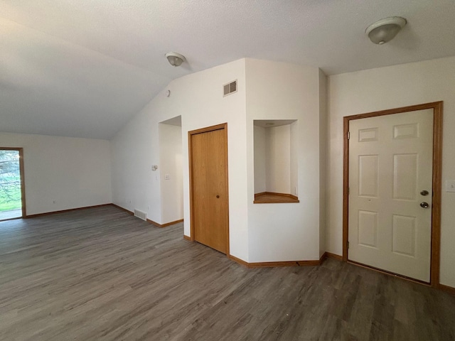 809 Aspen Cir, Waite Park, MN 56387 - unfurnished living room with wood finished floors and lofted ceiling