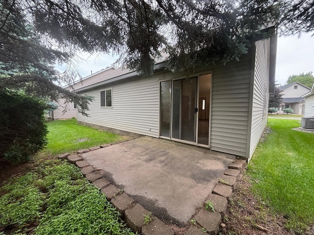 809 Aspen Cir, Waite Park, MN 56387 - back of house with a patio area and a lawn