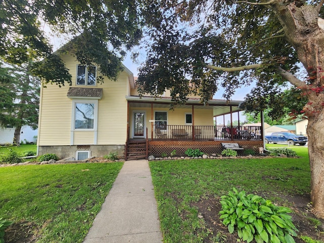 105 Main St, Brownsdale, MN 55918 - view of front of home with a porch and a front lawn