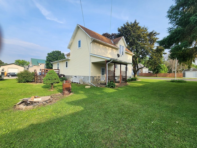 105 Main St, Brownsdale, MN 55918 - view of side of property with a lawn and a wooden deck