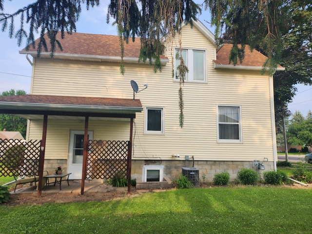 105 Main St, Brownsdale, MN 55918 - rear view of property with a yard and a shingled roof