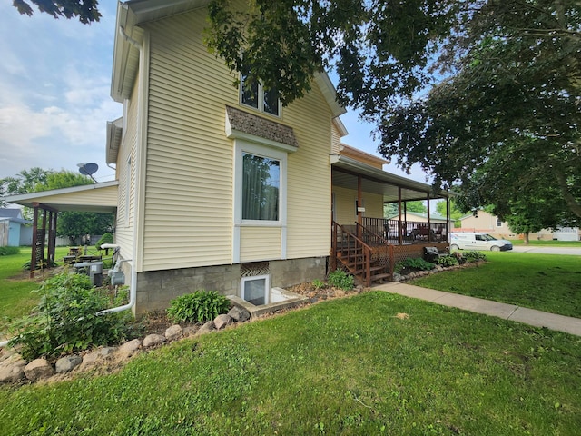 105 Main St, Brownsdale, MN 55918 - view of property exterior with a porch and a yard