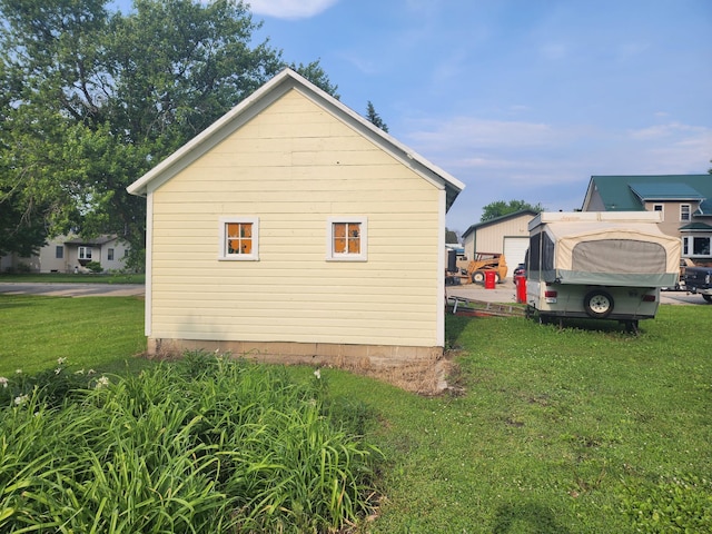 105 Main St, Brownsdale, MN 55918 - view of side of home featuring a lawn