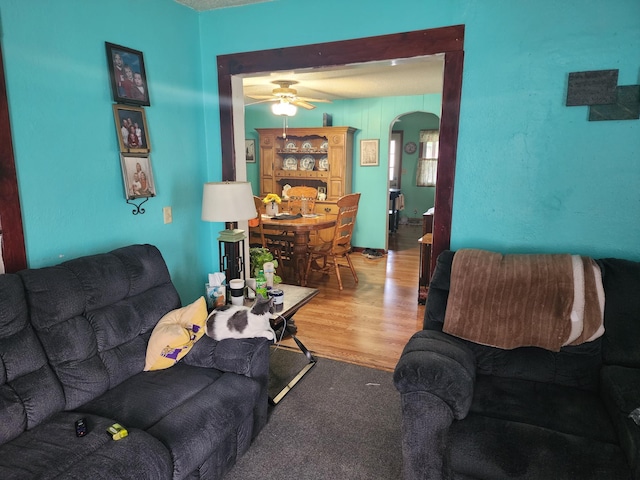 105 Main St, Brownsdale, MN 55918 - living room with arched walkways, wood finished floors, and ceiling fan