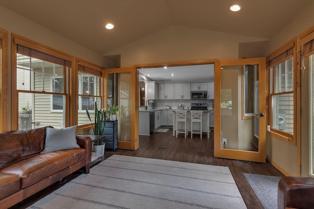 504 3rd St N, Sartell, MN 56377 - living room featuring vaulted ceiling, dark wood-type flooring, and recessed lighting