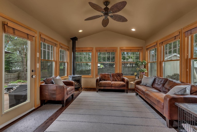 504 3rd St N, Sartell, MN 56377 - sunroom with a wood stove, vaulted ceiling, recessed lighting, wood finished floors, and a deck