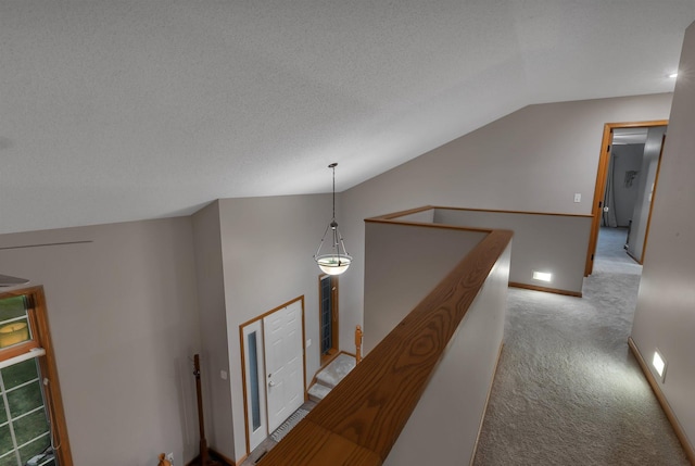504 3rd St N, Sartell, MN 56377 - hallway with lofted ceiling, carpet floors, and an upstairs landing