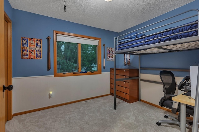 504 3rd St N, Sartell, MN 56377 - bedroom with carpet floors, a textured ceiling, and an office area