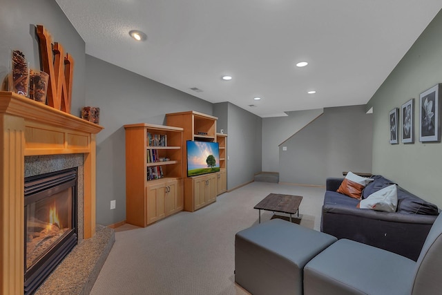 504 3rd St N, Sartell, MN 56377 - living area with light carpet, a glass covered fireplace, and recessed lighting