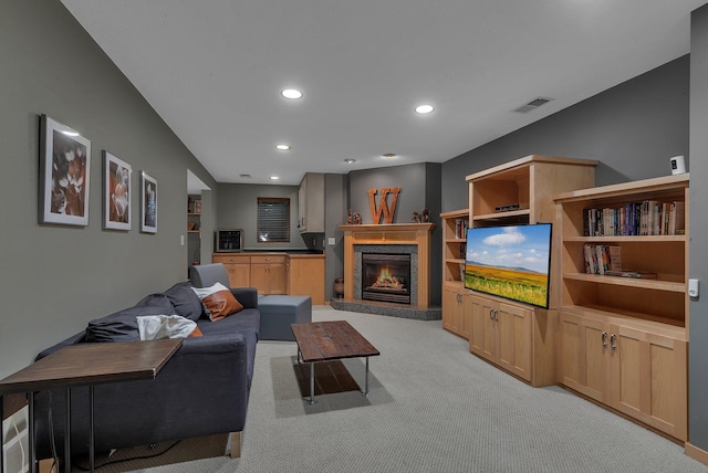 504 3rd St N, Sartell, MN 56377 - living area featuring light carpet, a lit fireplace, and recessed lighting