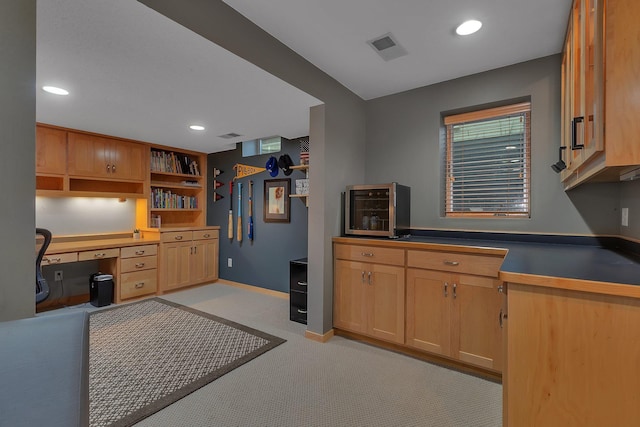 504 3rd St N, Sartell, MN 56377 - kitchen with built in desk, light carpet, recessed lighting, dark countertops, and open shelves
