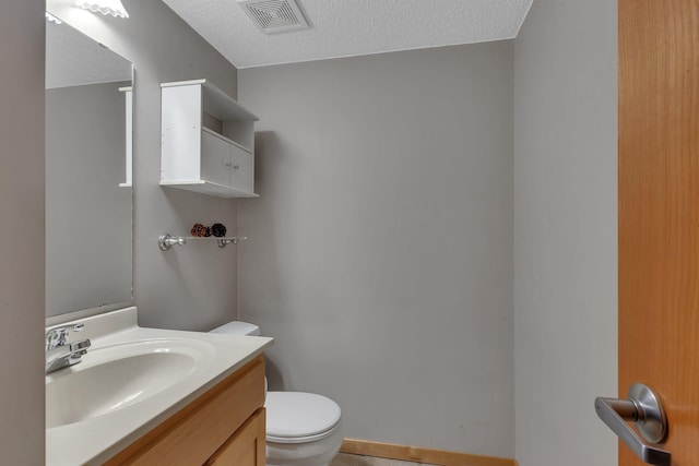 504 3rd St N, Sartell, MN 56377 - bathroom with vanity and a textured ceiling