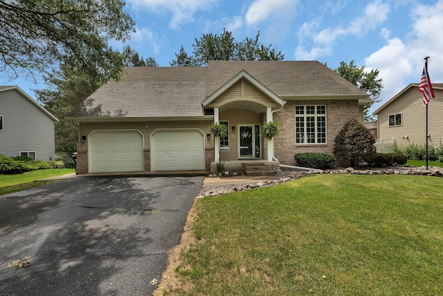 504 3rd St N, Sartell, MN 56377 - traditional-style home featuring brick siding, a garage, driveway, and a front yard