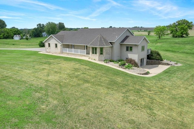 19800 Stephan Dr, Minnewaska Twp, MN 56381 - view of front of home with a front yard, covered porch, and a garage