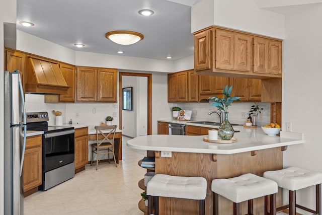 19800 Stephan Dr, Minnewaska Twp, MN 56381 - kitchen featuring stainless steel appliances, custom exhaust hood, a peninsula, light countertops, and tasteful backsplash