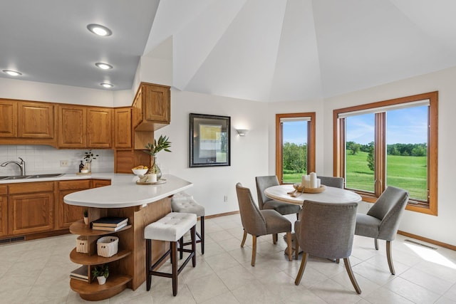 19800 Stephan Dr, Minnewaska Twp, MN 56381 - dining room featuring vaulted ceiling, light tile patterned floors, and recessed lighting