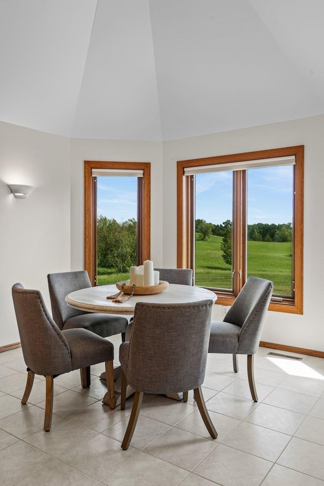 19800 Stephan Dr, Minnewaska Twp, MN 56381 - dining room with high vaulted ceiling and light tile patterned floors