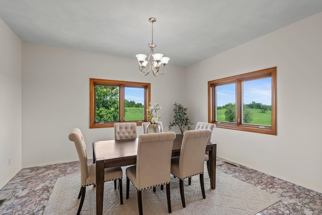 19800 Stephan Dr, Minnewaska Twp, MN 56381 - dining area with a chandelier and baseboards