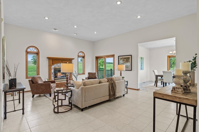 19800 Stephan Dr, Minnewaska Twp, MN 56381 - living area with a chandelier, recessed lighting, a fireplace, and light tile patterned flooring